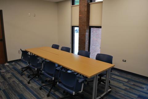 One long table with four chairs on each side