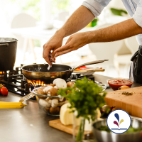Person cooking with a variety of ingredients