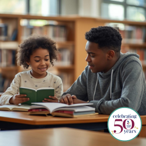 Child reading to a teenager