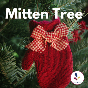 A red mitten hanging on a Christmas tree with text, "Mitten Tree"