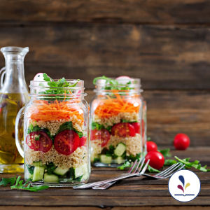 Salads in two jars, bottle of olive oil