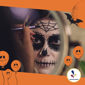 Person applying Halloween-theme makeup in mirror