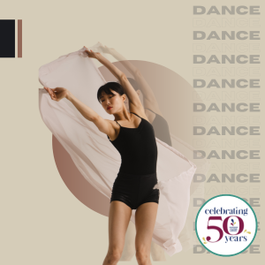 Woman dancing while holding flowing scarf behind her